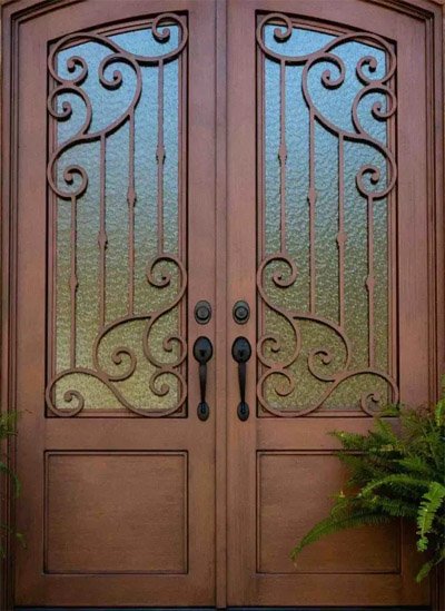 Handcrafted wrought iron door with glass panels