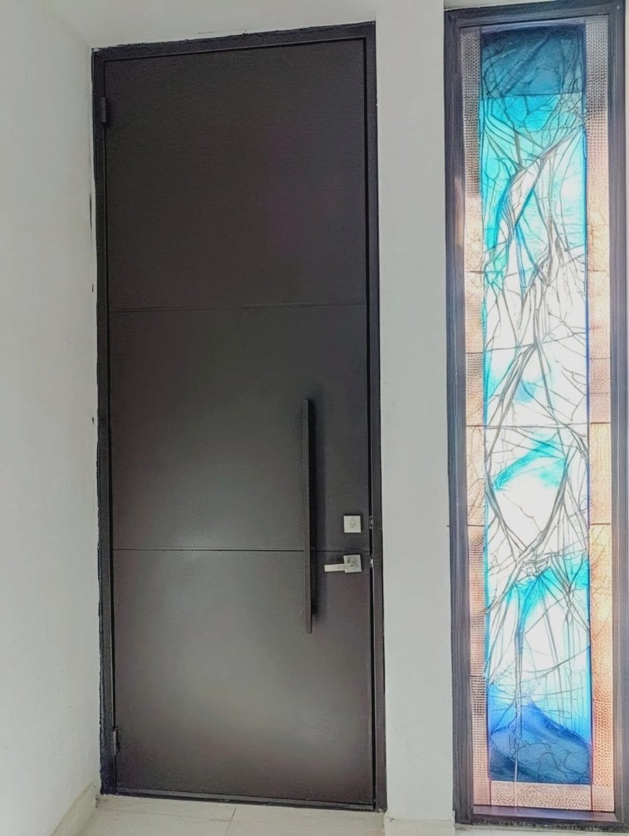 Iron door with art glass sidelight